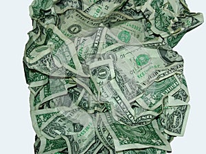 One dollar bills crumpled in pile