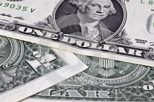One dollar bills lying in disarray