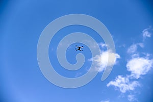 One drone on white blue sky clouds on background and space