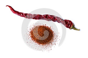 One dry red chili pepper on white background. Desiccated milled paprika.