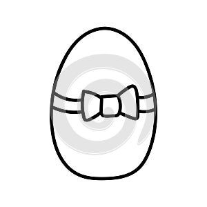One easter egg with black bow ornament on white background. Simple Spring holiday symbols