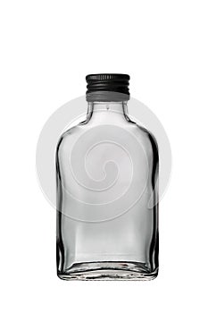 One empty liquor alcohol glass russian vodka bottle with black cap and isolated on a white background