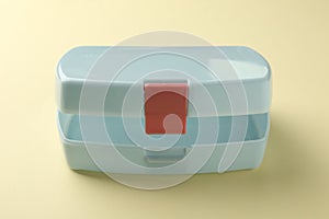 One empty lunch box on beige background