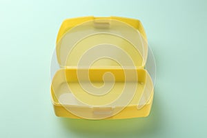 One empty lunch box on light blue background