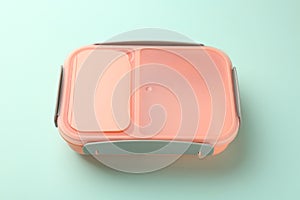 One empty lunch box on light blue background