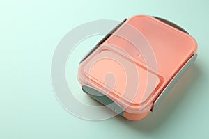 One empty lunch box on light blue background, space for text