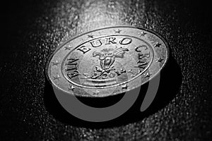 One euro cent coin close up black and white blurred