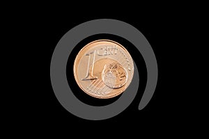 A one Euro cent coin isolated on a black background