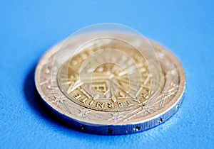 One euro coin on blue background