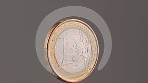 One euro coin close up on grey background