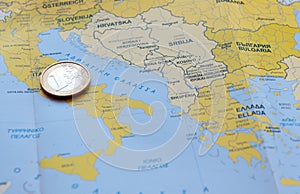 One Euro coin on a European map