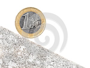 One Euro coin on inclined plane photo