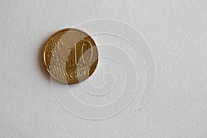 One euro coin lie on isolated white background Denomination is ten euro cent