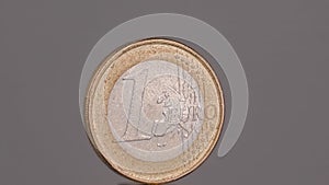 One euro coin macro in gray background