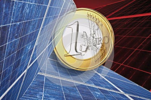 One euro coin and solar panel against red background, close up.