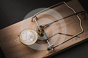 One euro in a mousetrap. Financial trap concept
