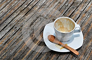 One finished cup of espresso coffee on bamboo table