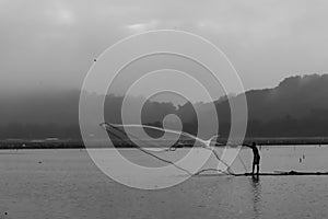 One fisherman on bamboo raft