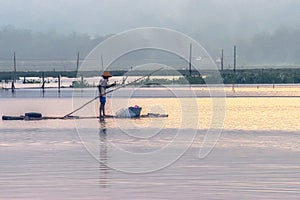 One fisherman on bamboo raft