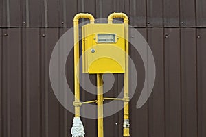 One gas meter in a yellow metal box