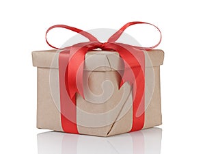 One gift christmas box wrapped with kraft paper and red bow