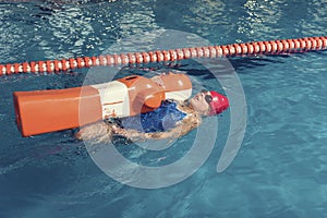 One Girl with Training Dummy in a Pool