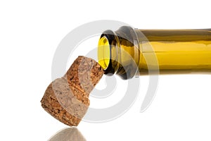 One glass bottle with cork, close-up, isolated on white, black background and top view. photo