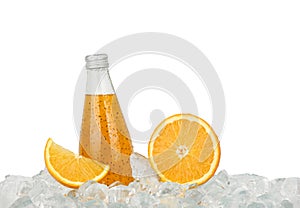 One glass bottle of orange drink on ice