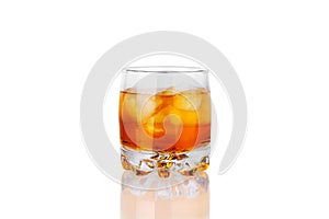 One glass of whiskey with ice cubes and reflection on white background isolated close up, alcohol cocktail, rum, brandy, scotch