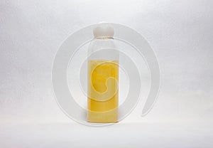 One glassy bottle of yellow shower gel