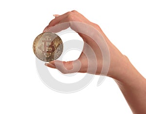 One Gold Coin Bitcoin in hand of the girl, isolated on white background.