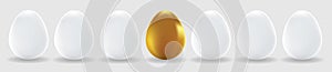 One gold egg and white eggs