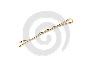 One gold hair pin on white