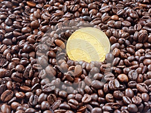 One golden bitcoin closeup on coffee beans background