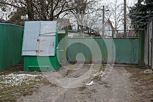 One gray metal closed well on a rural street