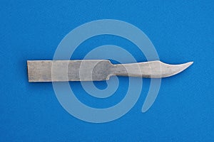 One gray metal knife from a workpiece