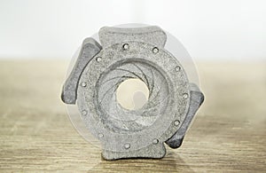 One gray model camera shutter printed on 3D printer Object printed on 3D printer
