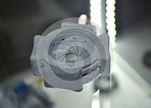 One gray model camera shutter printed on 3D printer. Object printed 3D printer