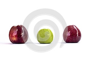 Isolated One green apple and two red apples on a white background