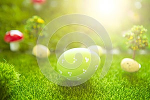 One Green Easter eggs on meadow in Dreamland or fairy world