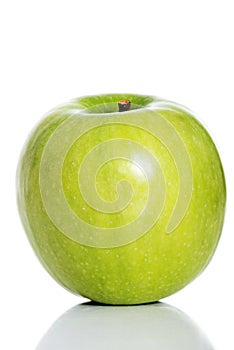 One green separated apple on white.