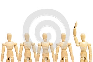 One in group of wooden figure mannequin rise hand up on white background.