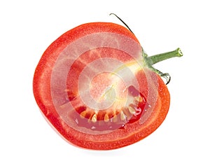 One half of ripe fresh red tomato isolated on white background