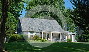 One and a Half Story Home with Porch Swing