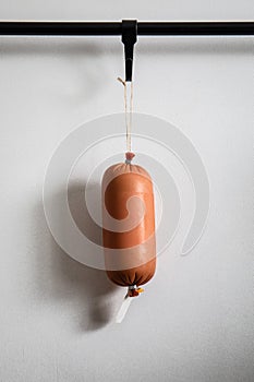 One ham sausage package on white background