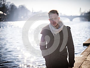 One handsome young man in urban setting in European city