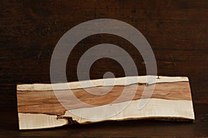 One Hawthorn log on antique wood background with copyspace