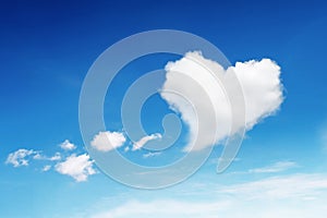 one heart shaped cloud on blue sky