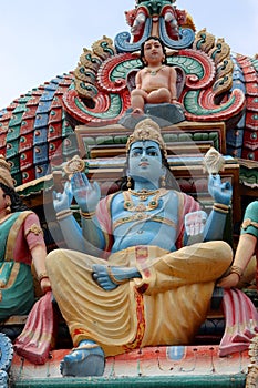 One Hindu deities on the roof of Sri Mariamman Hindu temple in Chinatown Singapore