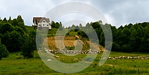 One house build on the edge of a hill cliff